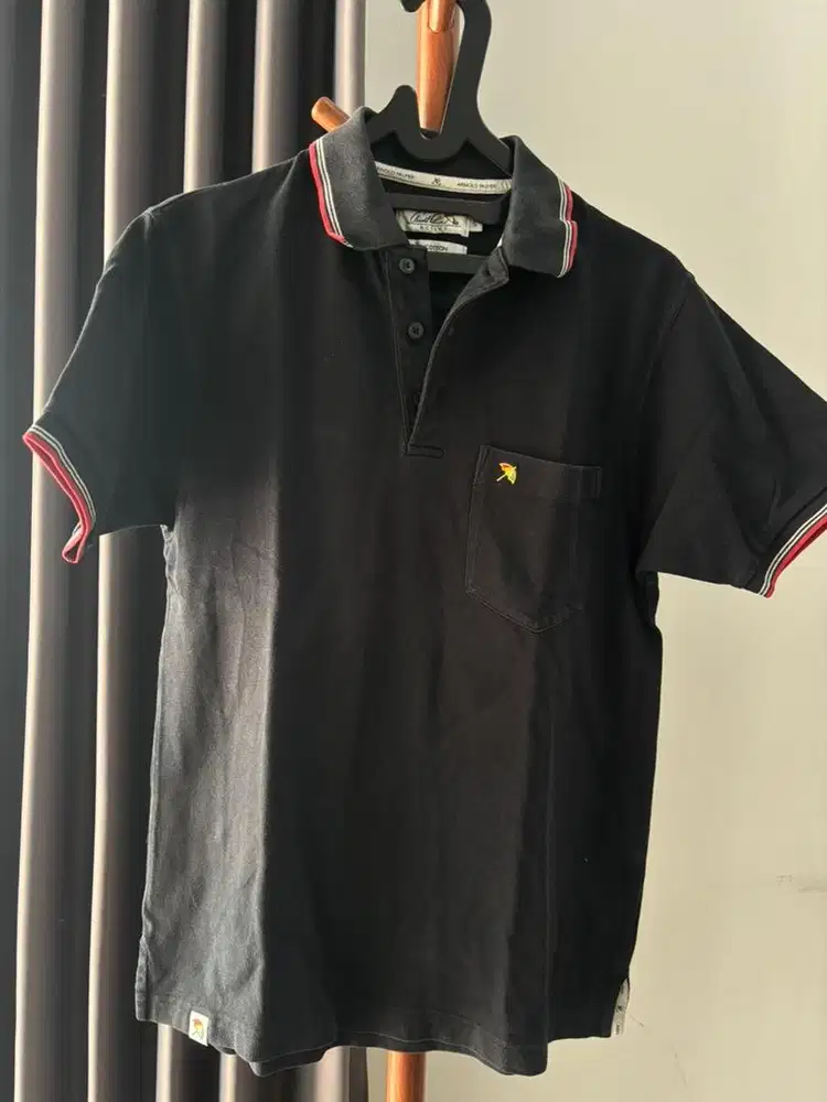 Polo hitam Arnold Palmer pria