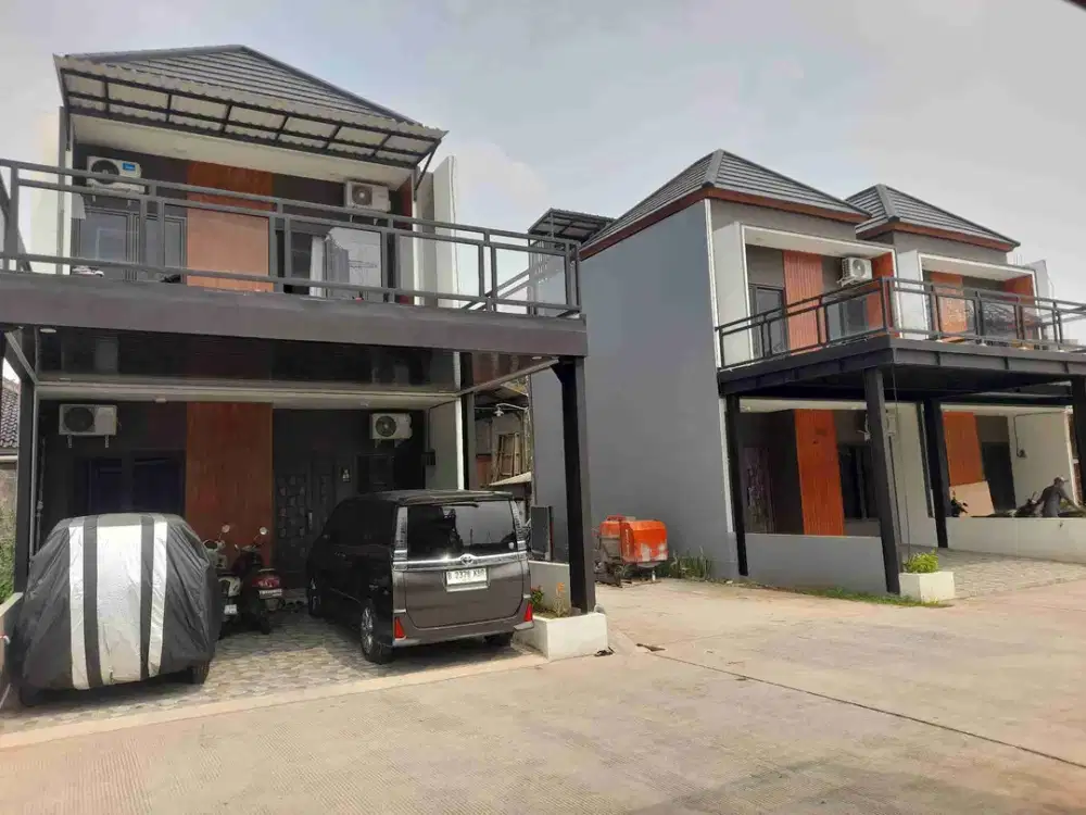 Rumah cluster cakep kualitas terjamij lokasi strategis pinggir jalan raya