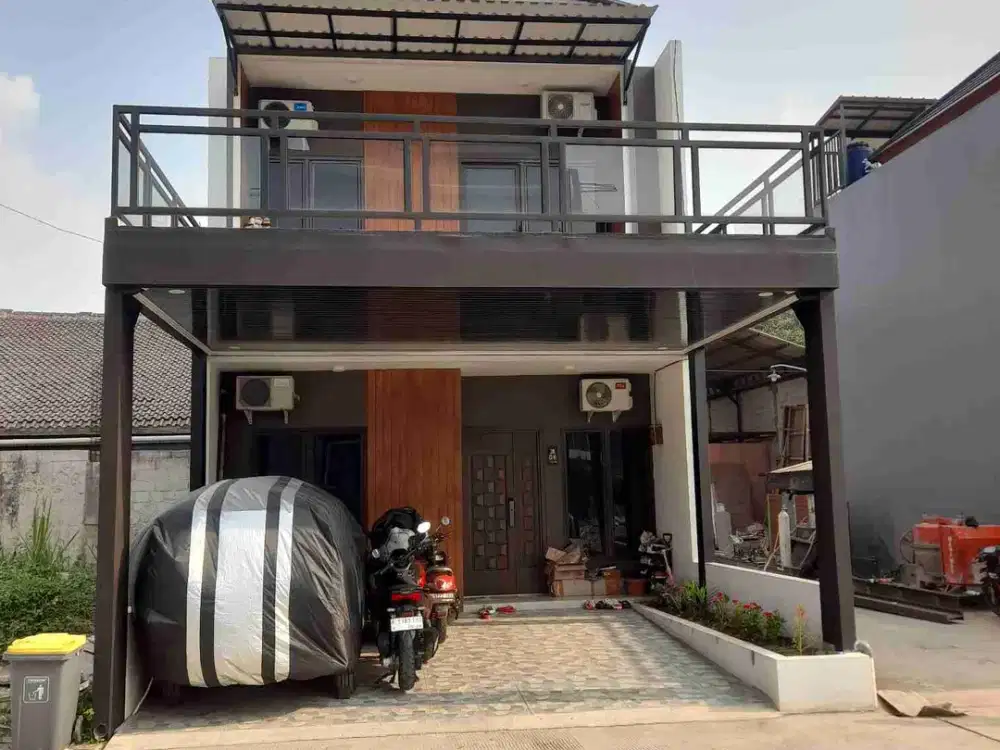 Rumah mewah 2lantai berkualitas lokasi nempel jalan raya Jatiwarna