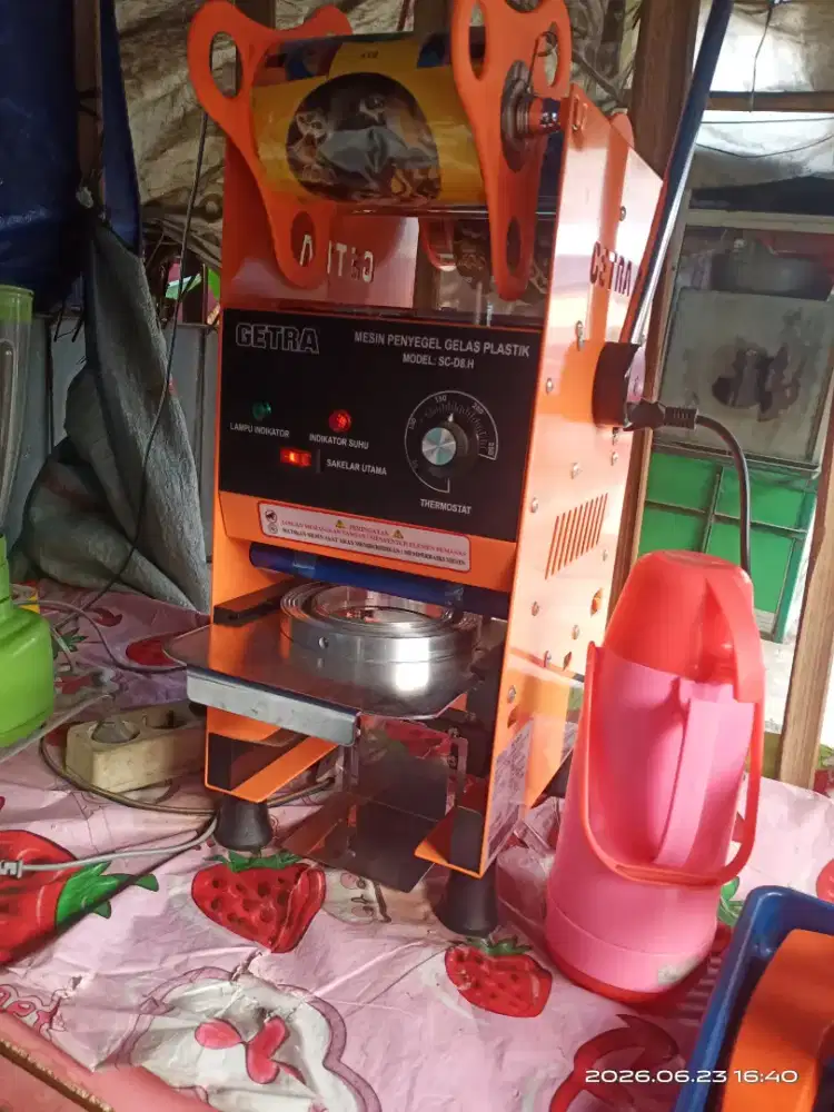 Mesin cup sealer merek getra