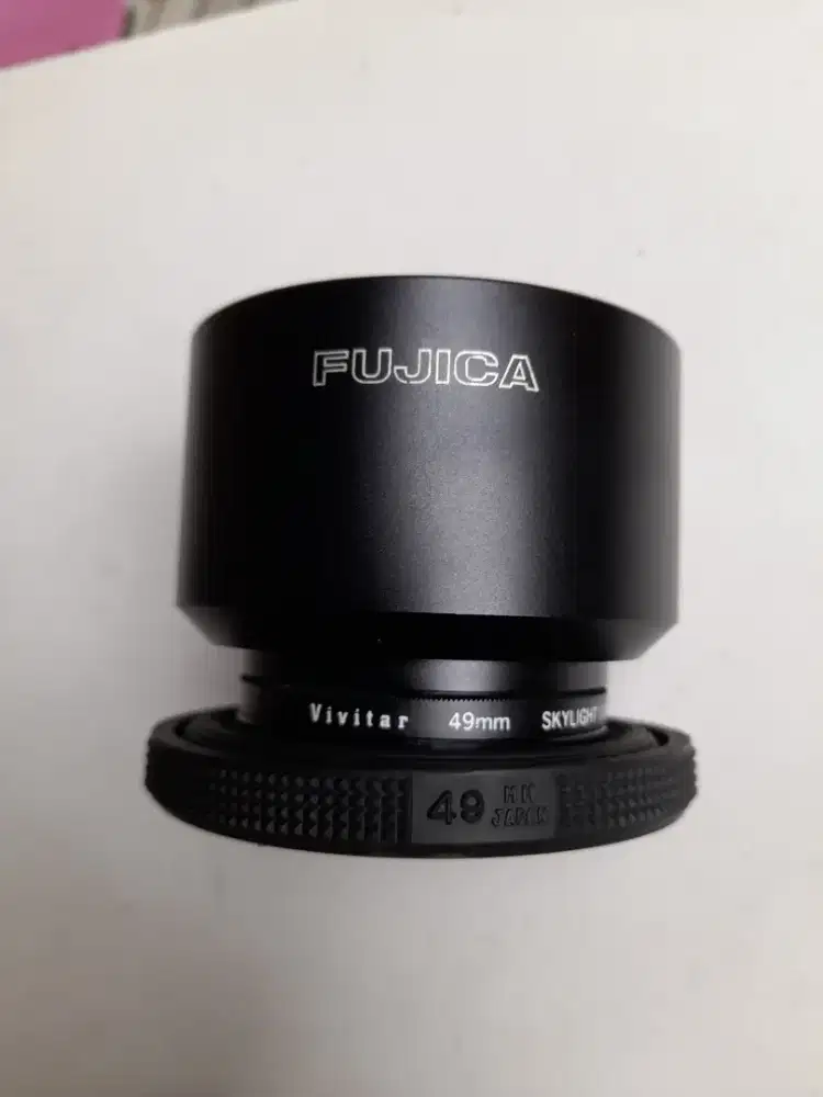 Lens hood dan filter sky light ukuran 49mm