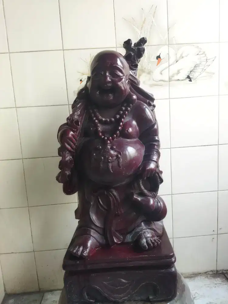 Patung buddha tertawa membawa hoki