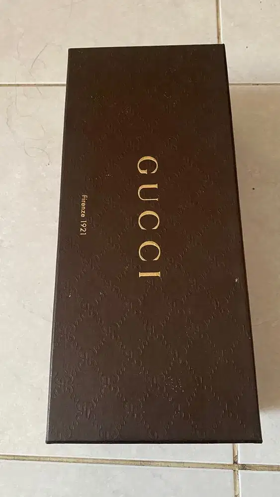 This authentic GUCCI Brown luxury packaging BOX gold toned logo print