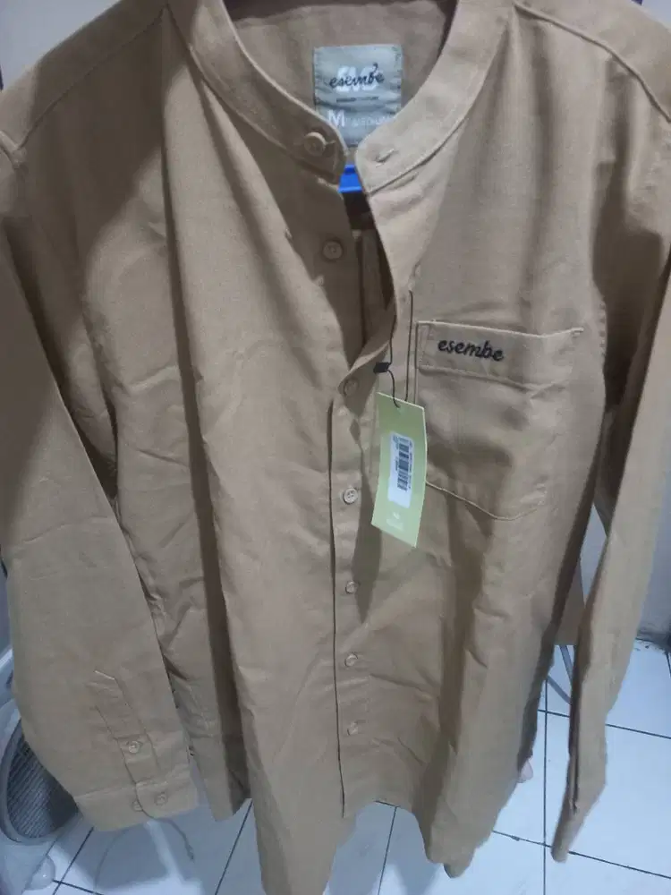 Baju muslim ( couture ) dan sarung tenun AL MIA.