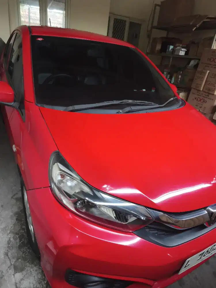Mobil Brio Merah Satya