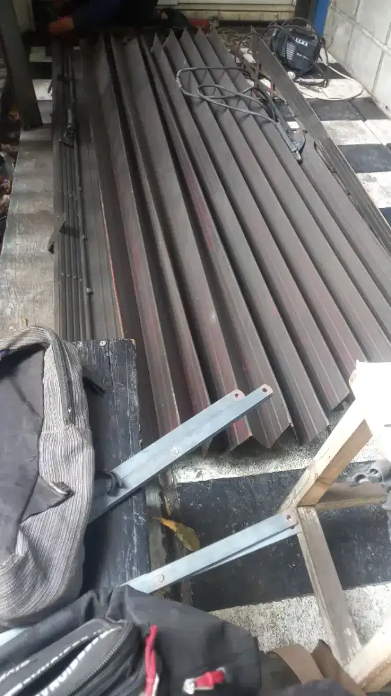 Tukang perbaikan rolling door folding gate murah