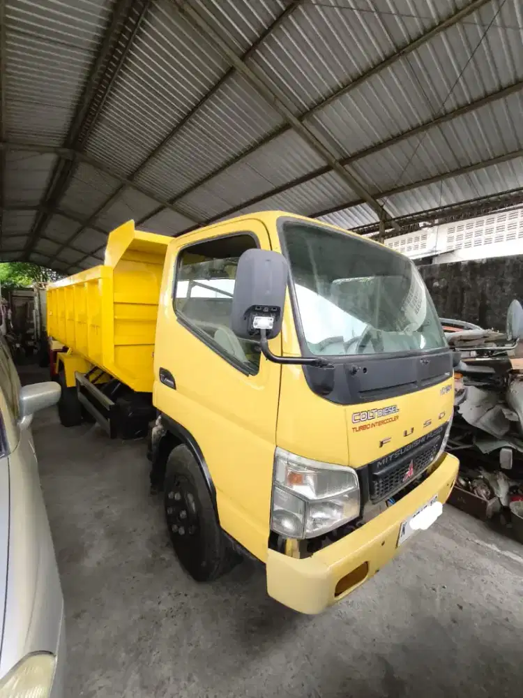 Mitsubishi colt diesel FE 74HD dump truk