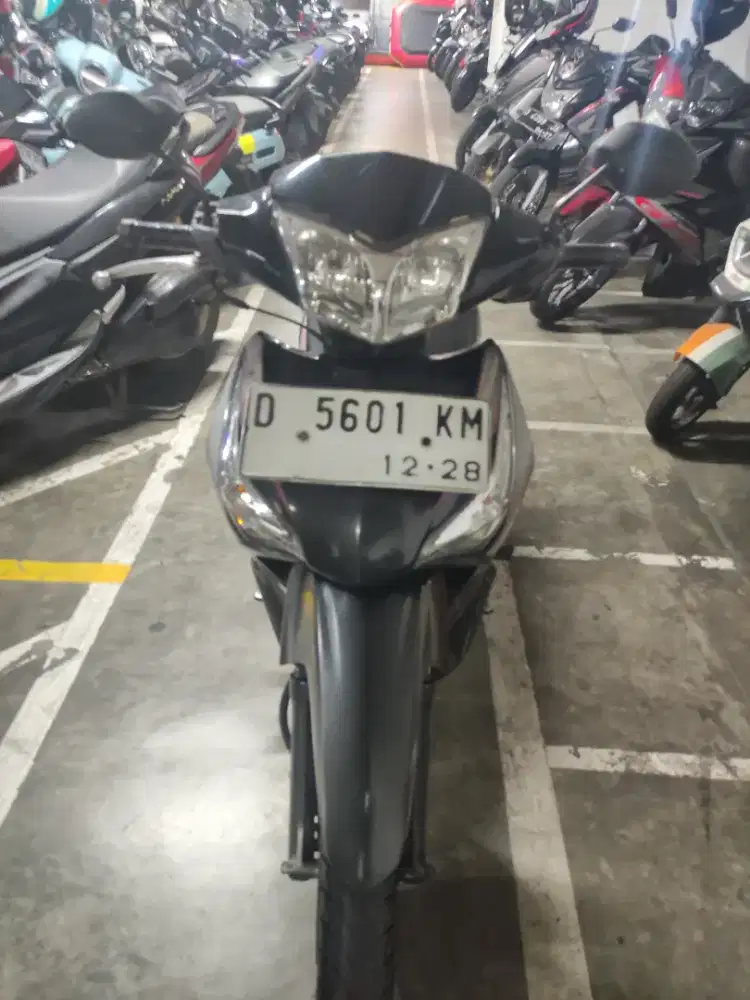 Supra X 125 helm in tahun 2013