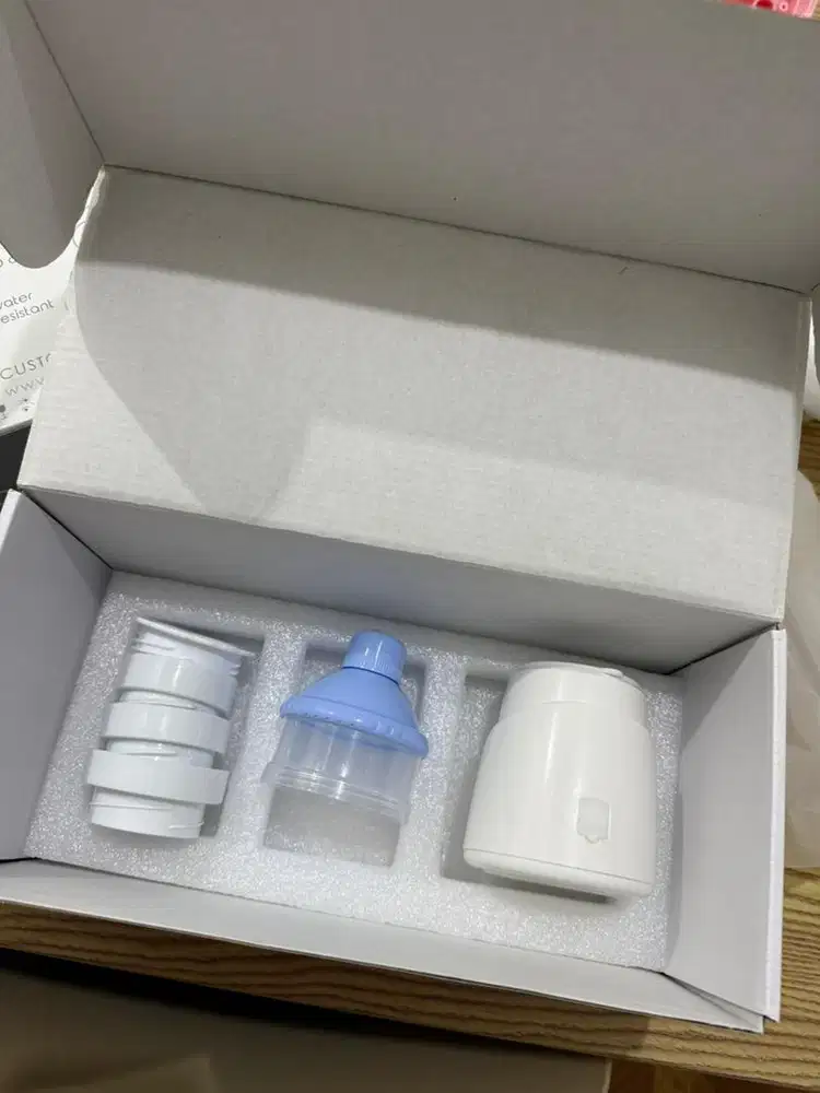 Penghangat susu portable