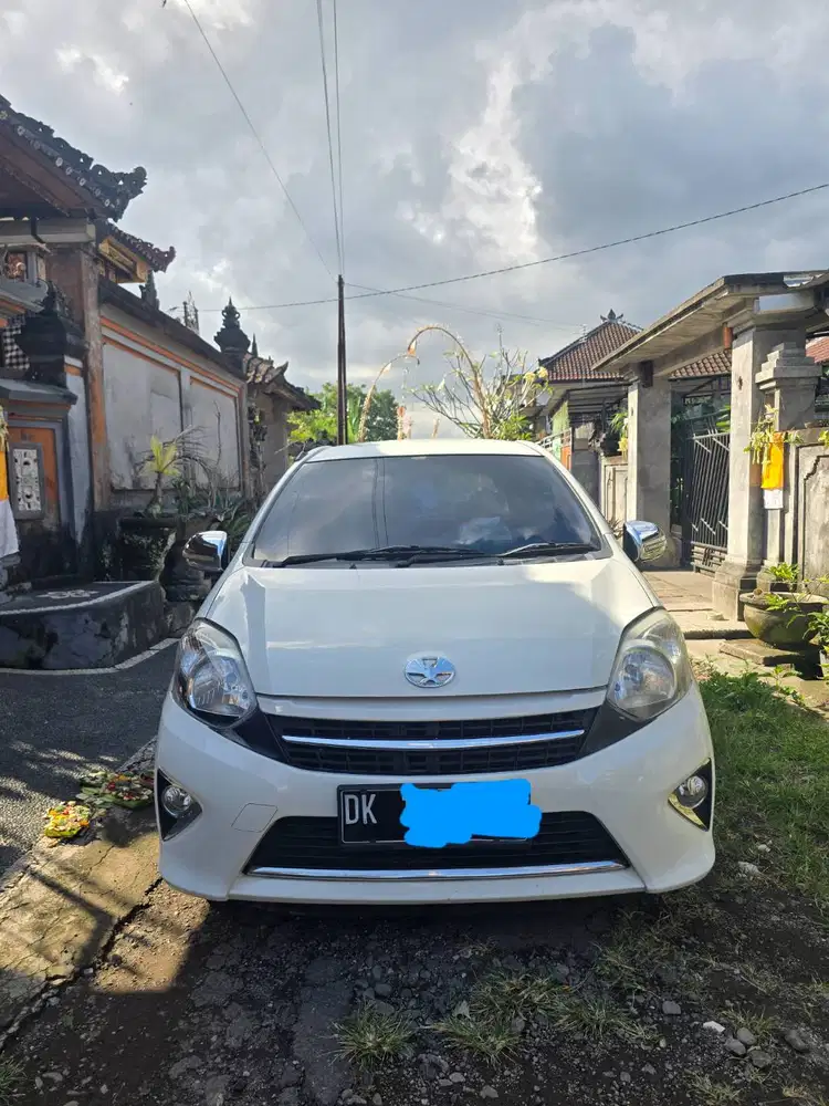 Jual Agya Matic warna putih, thn 2016, tipe 1.0 G, Km 140k plat Dps