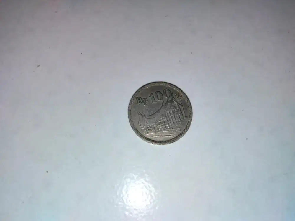 Uang koin jadul 100 rupiah gambar rumah gadang
