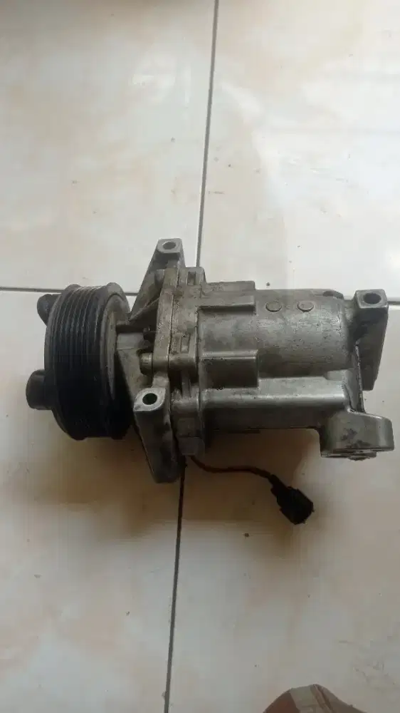 Kompresor ac mobil grand livina 2007 original