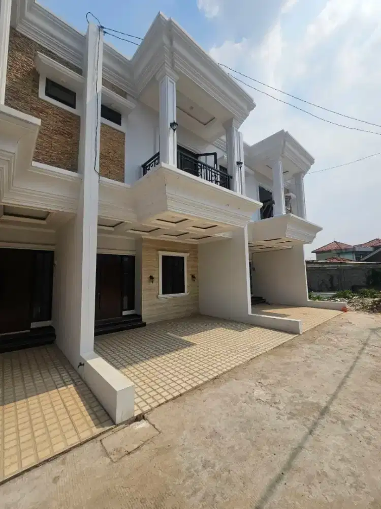 Rumah dua lantai harga murah dinding bata merah