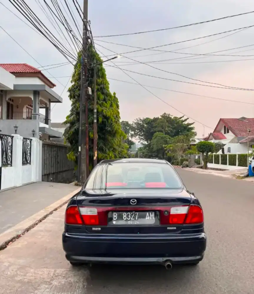Mazda familia 1999 manual