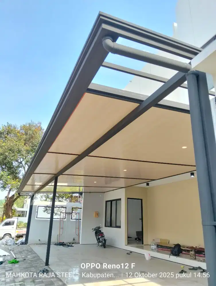 Rumah makin adem dengan kanopi kombinasi modern