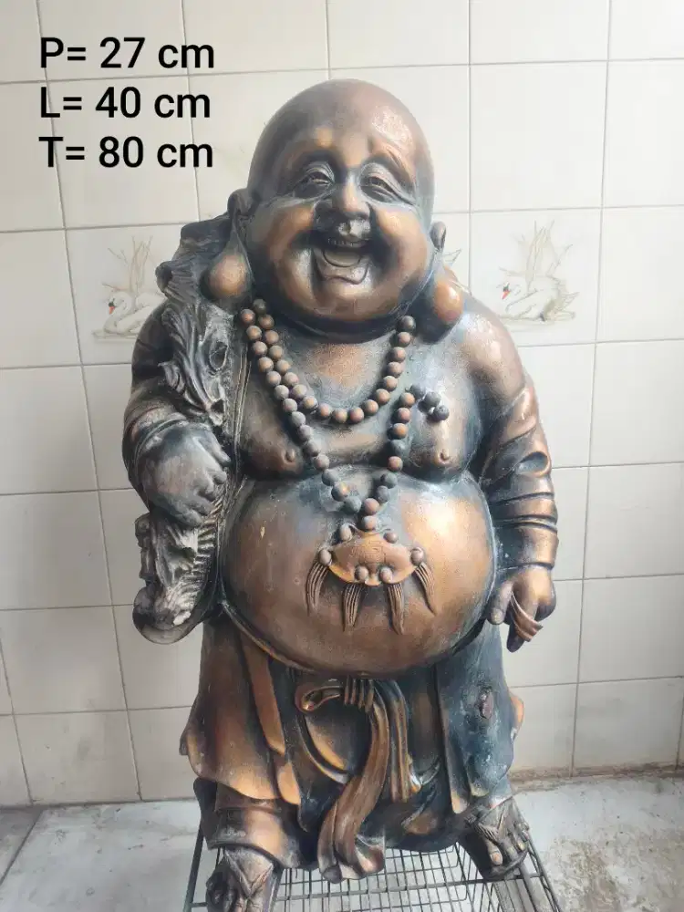 Patung buddha bahagia bawa uang