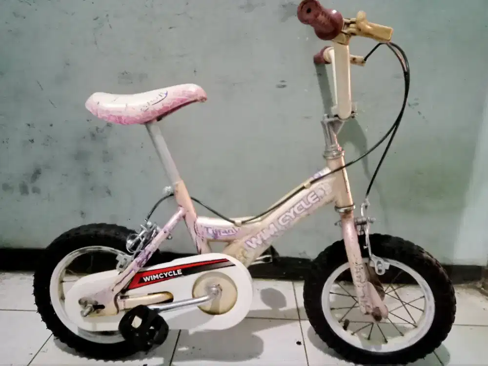 Dijual sepeda mini merk WIMCYCLE ring 12 kondisi bagus keker normal.