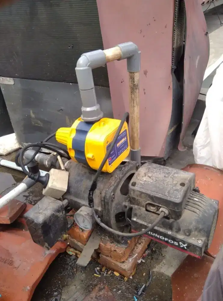 Servis pompa air bergaransi,gulung dinamo,pemasangan baru,cabut pipa