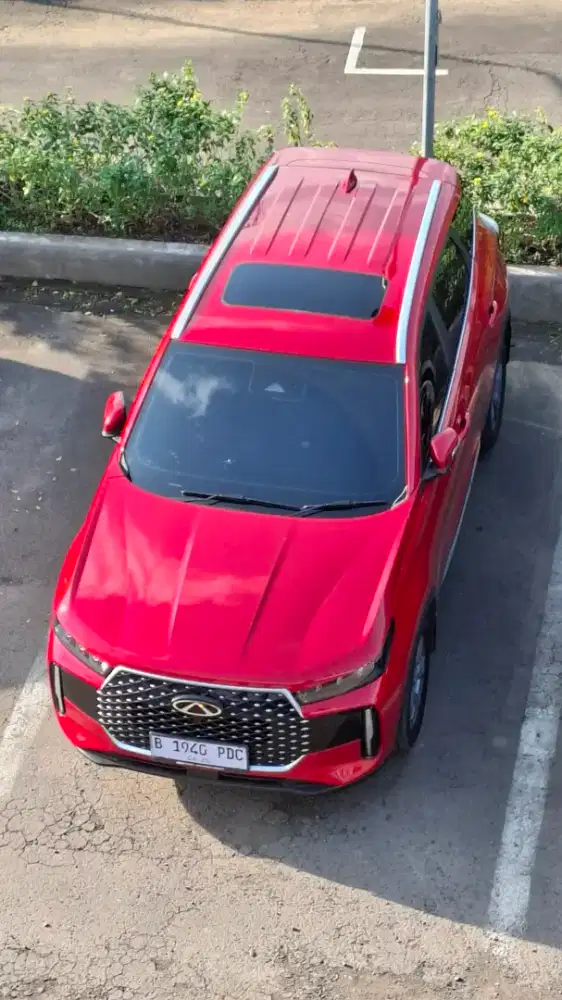 Tiggo cross premium merah merona