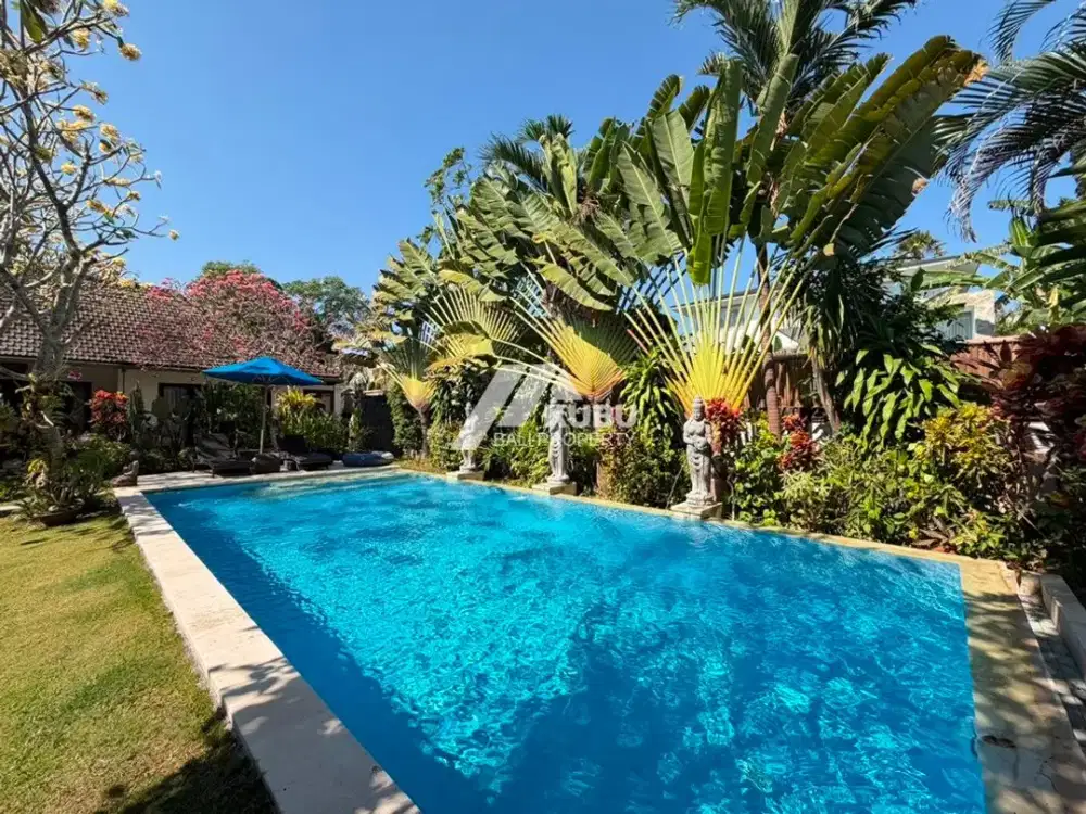 KBP1665 A stunning villa blending modern minimalist design with traditional Joglo elements, situated within a residential complex.