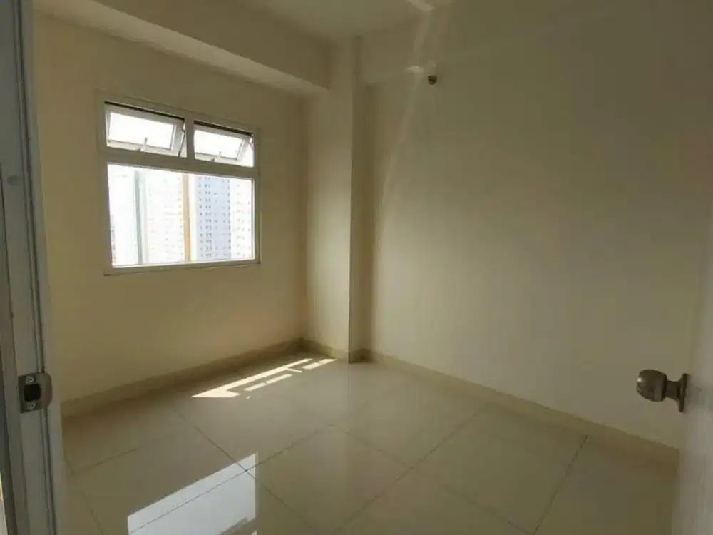 Apartemen the green pramuka city 2 kamar kosong tahunan