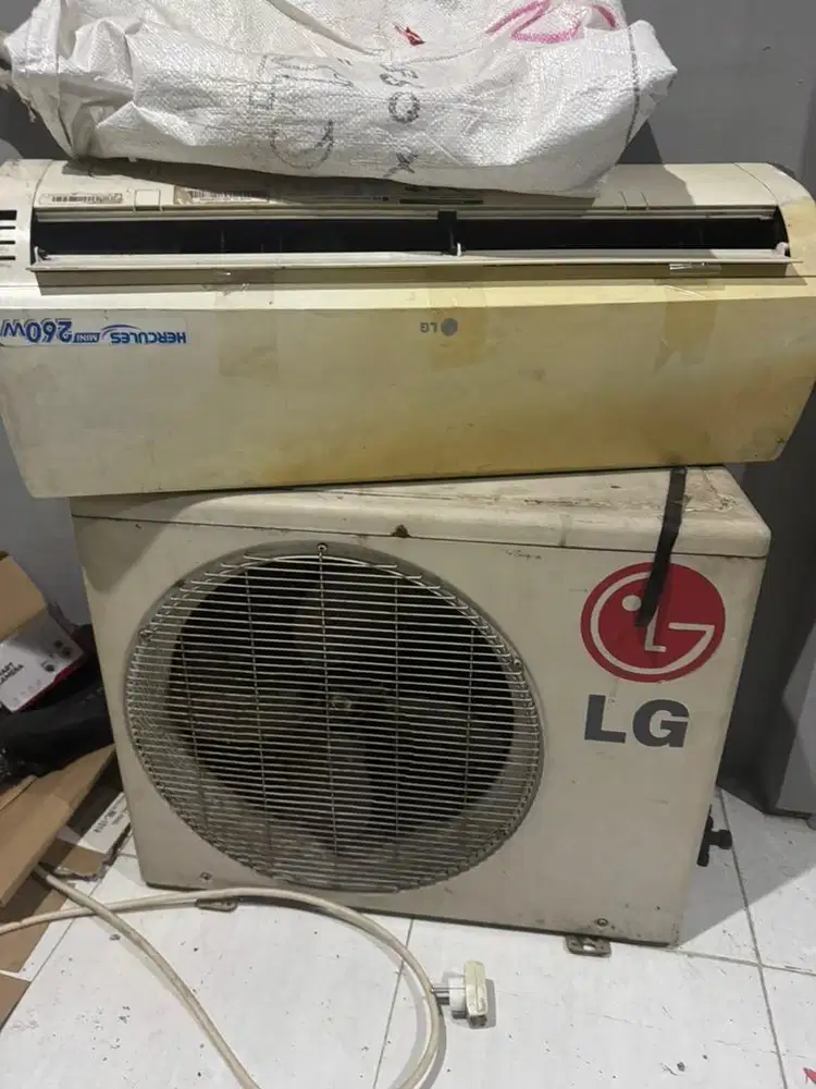 AC merek LG 1/2 PK