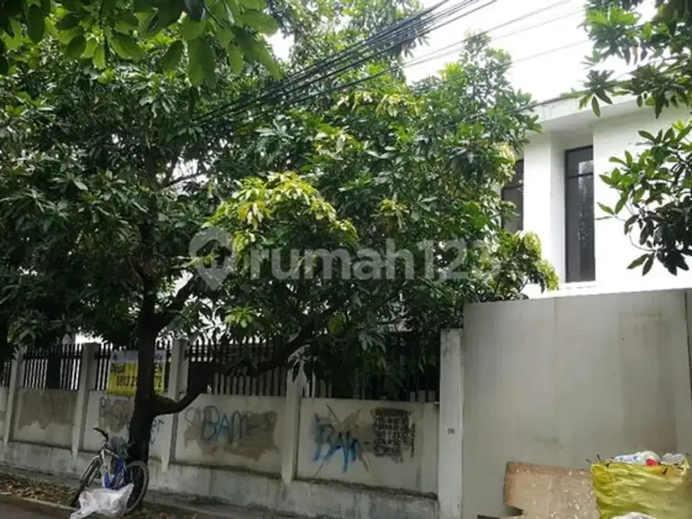 rumah asri pinggir jalan 2 jalur