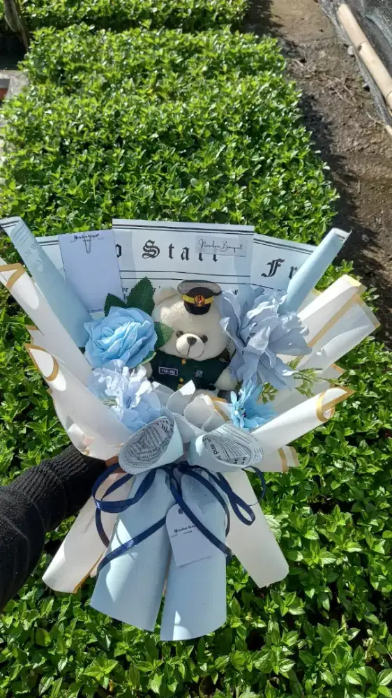 Buket bunga boneka profesi