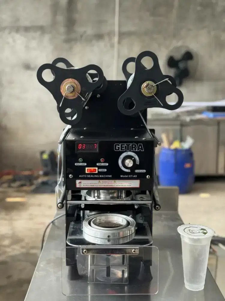 Cup sealer semi otomatis merk getra