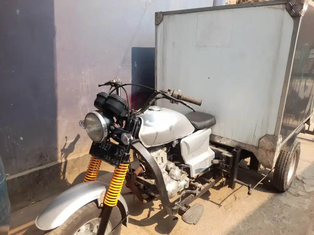 Motor roda tiga