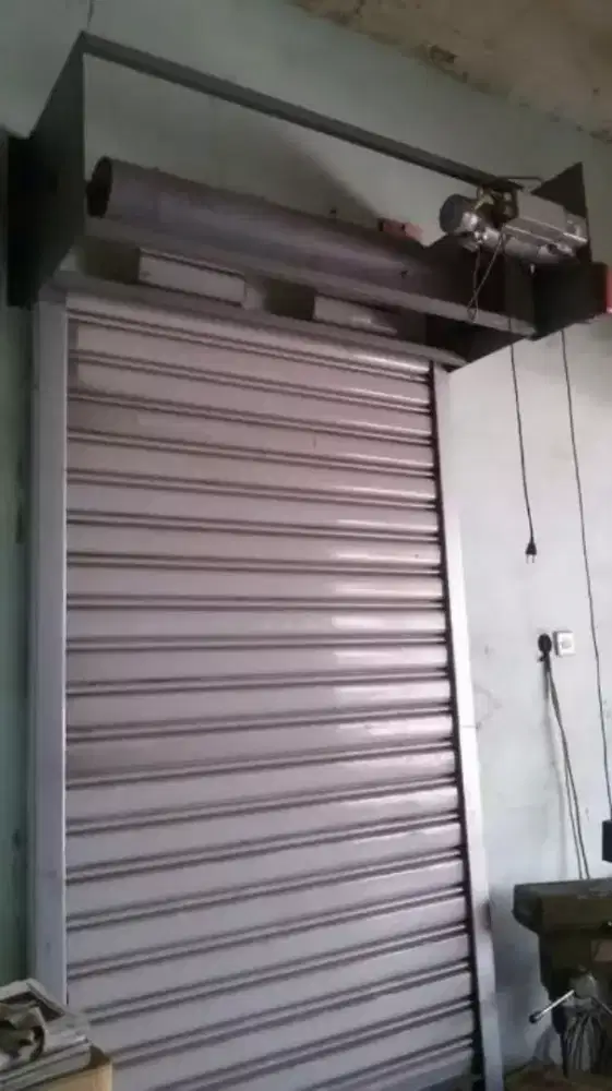tukang spesialis service rolling door folding gate murah
