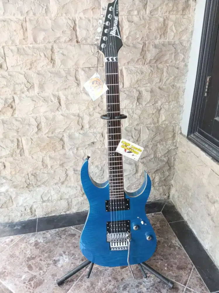 Gitar model Ibanez rg series blue top vener bodi