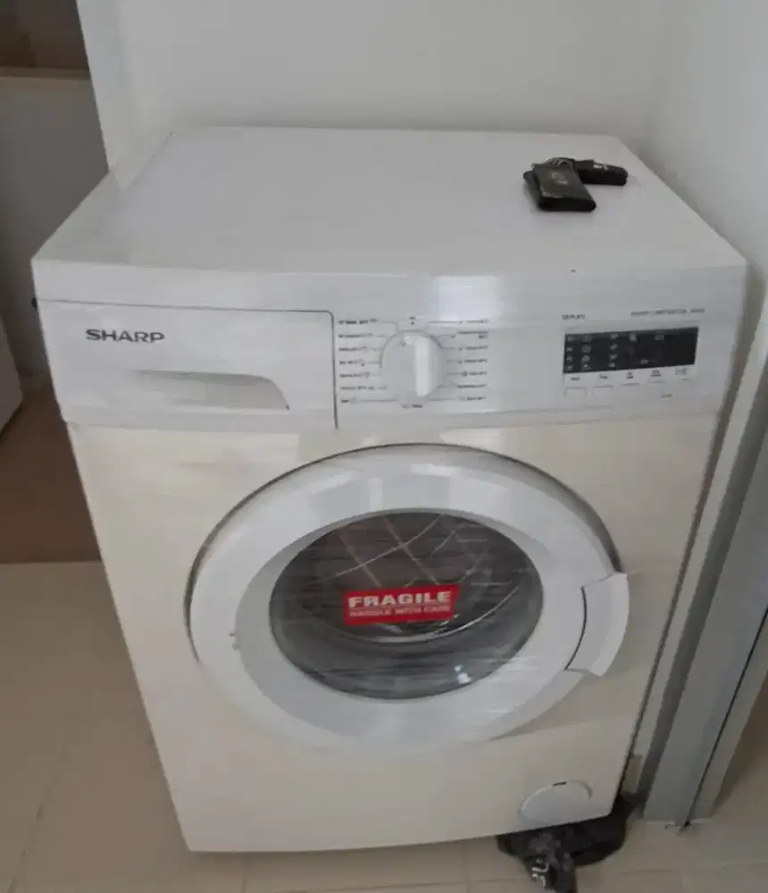 Mesin cuci front loading Sharp rusak