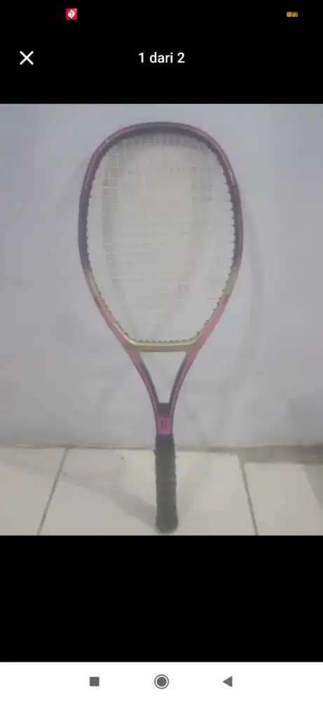 Raket tenis seperti baru