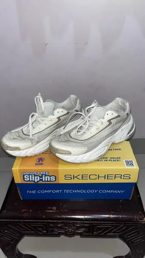 white and silver Skechers Hands Free Slip-ins sneakers