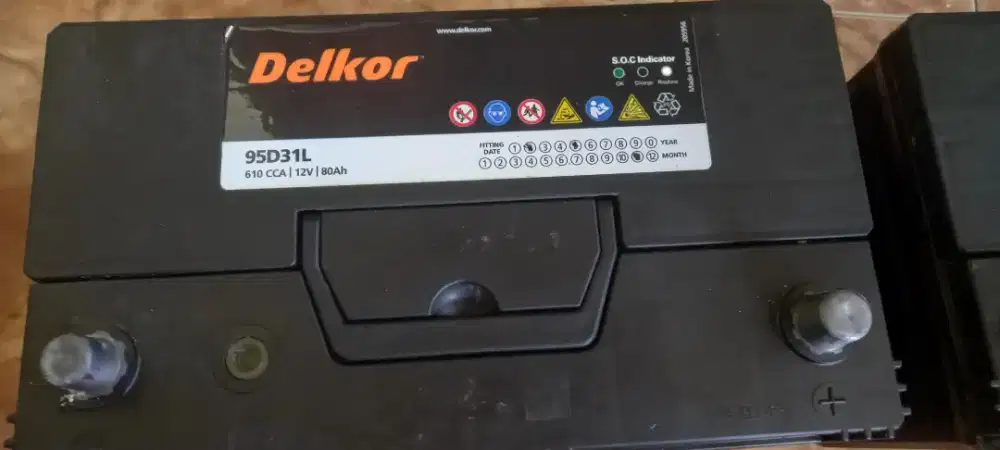 Jual accu kering bekas merk DELKOR tipe 95D31L 610 cca