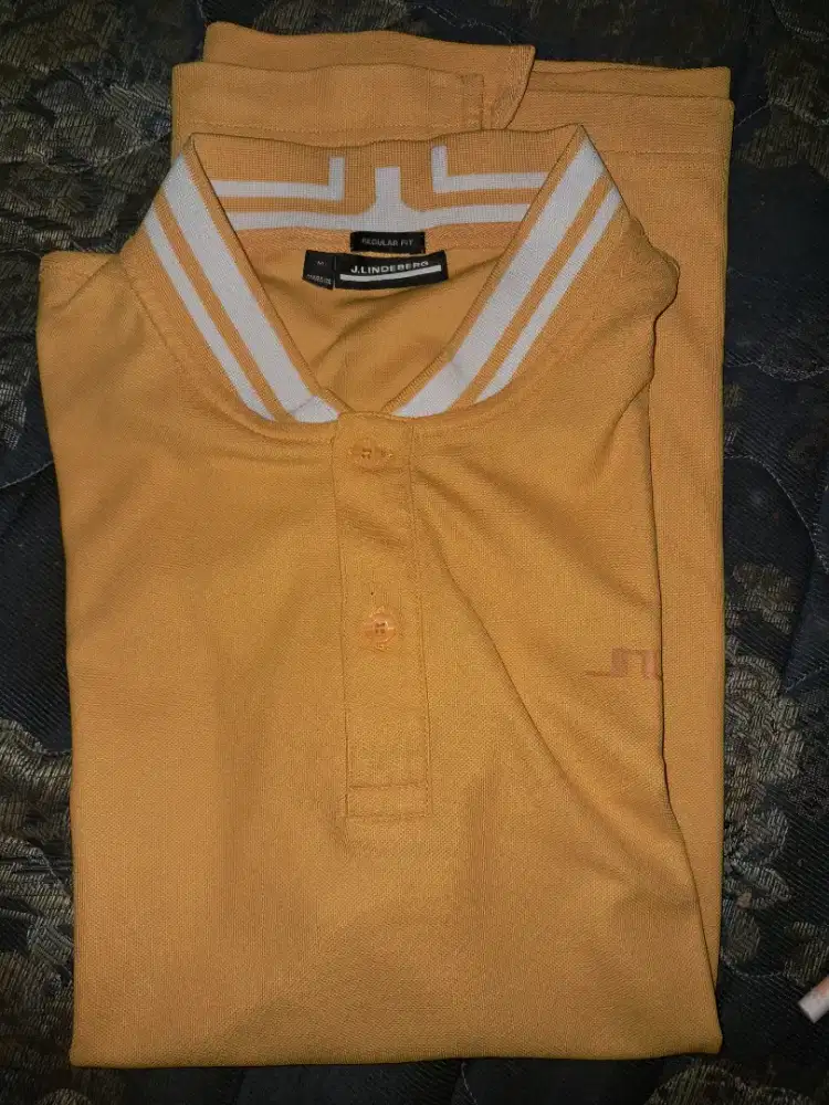 Baju kaos polo peria