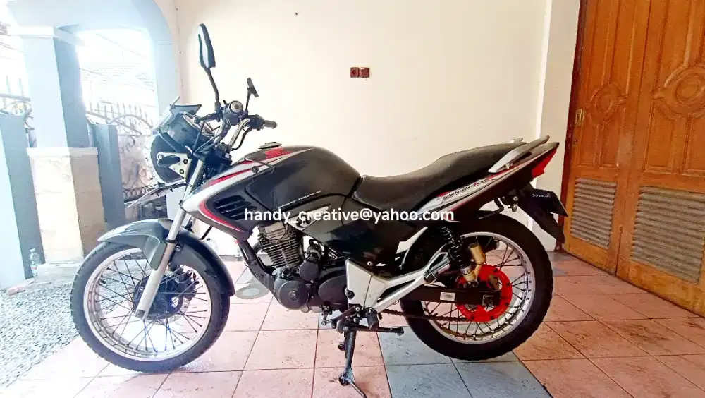 Tiger Revo 2007 Jari Merah