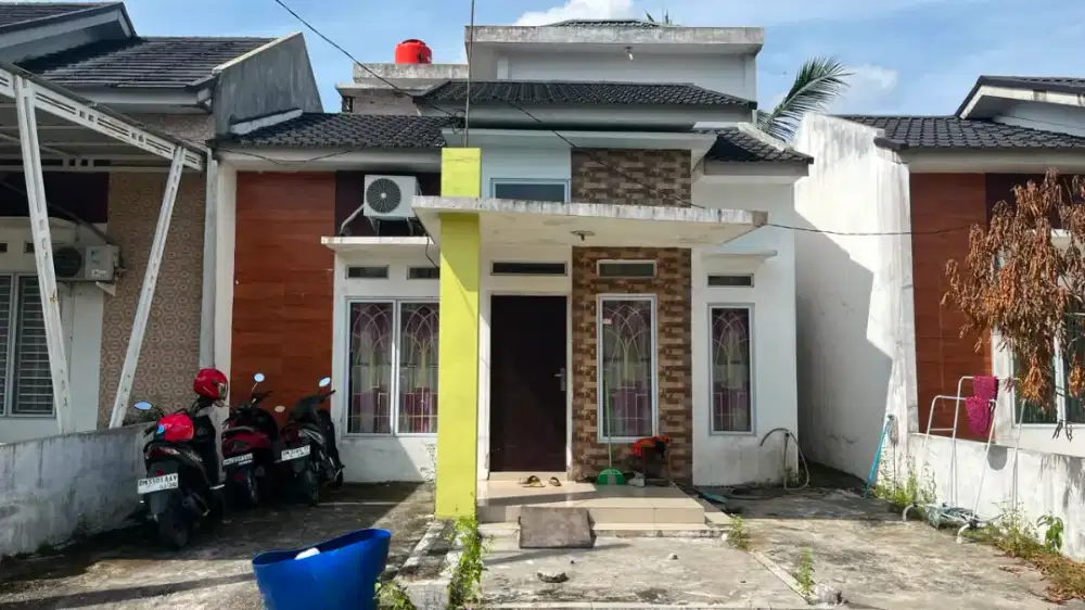 Di jual rumah di jl Garuda sakti km 2 panam