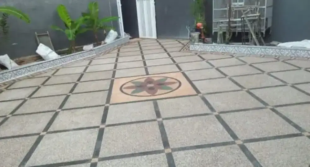 Pemasangan lantai batu sikat