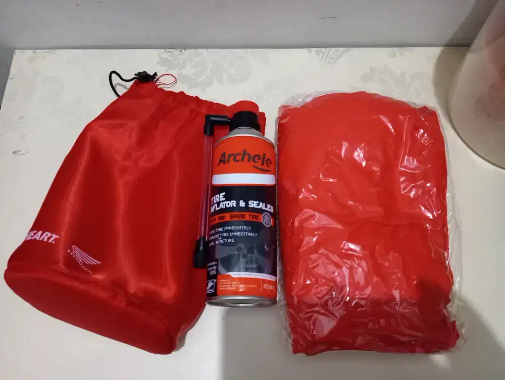 Cairan anti bocor ban Tubeless + jaket hujan original Honda