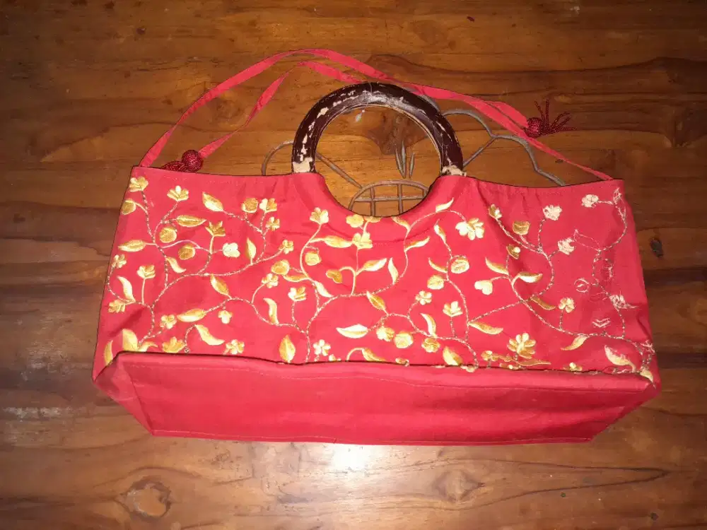 tas merah (handling copot)