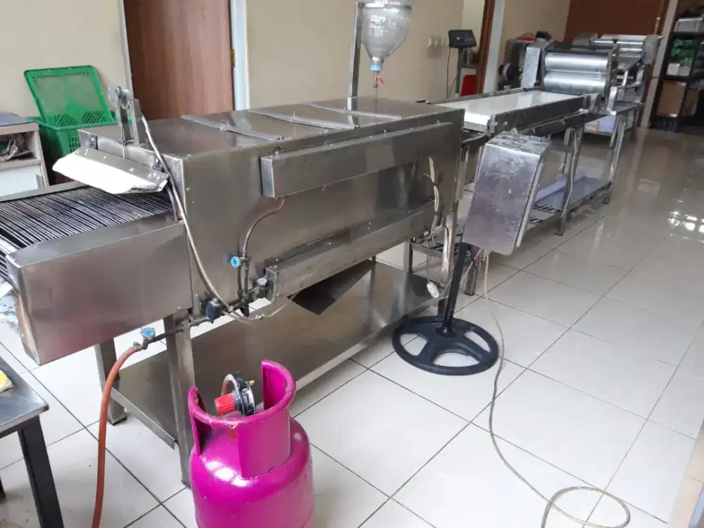 Mesin pembuat roti, memasak roti