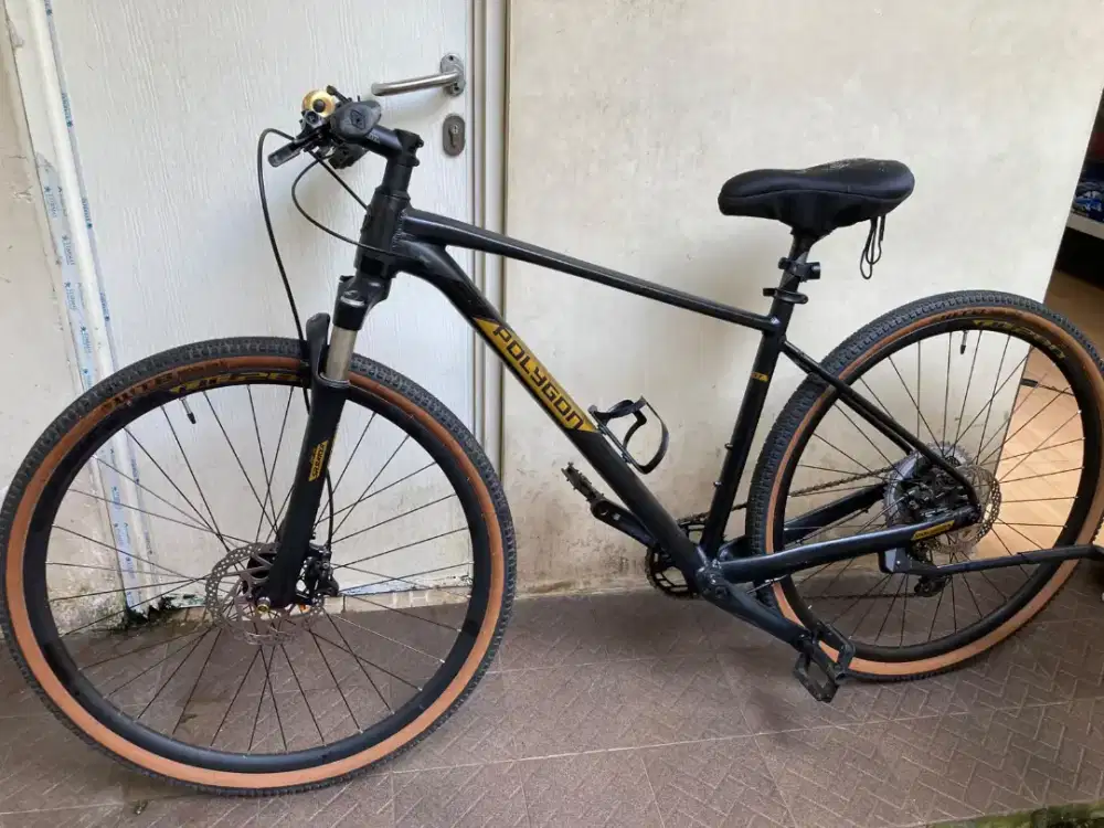 Sepeda pria polygon wtb riddler suntour