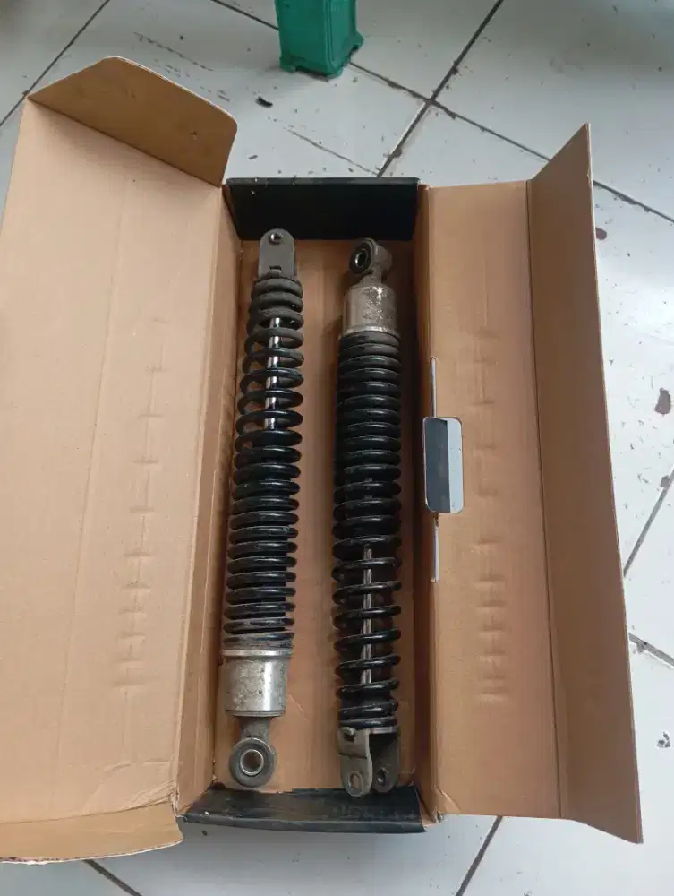 Shock motor listrik/bebek