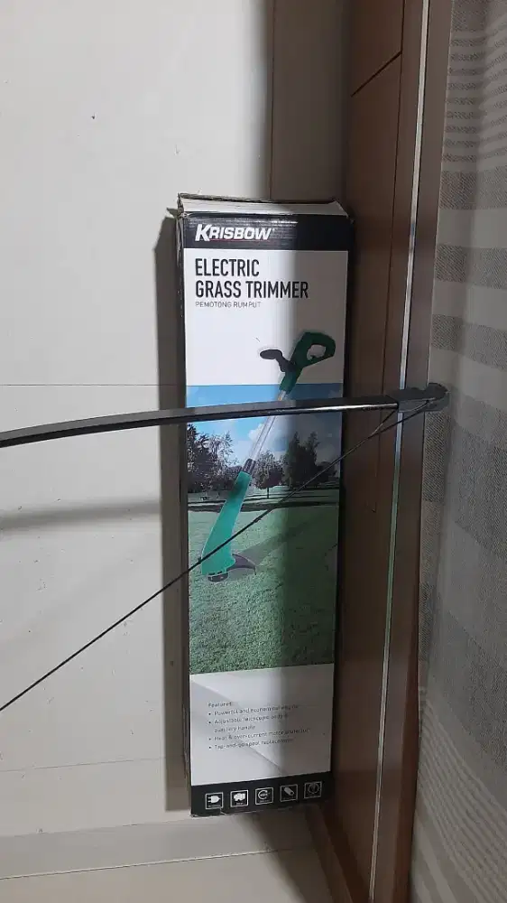 Electric grass trimmer ( PEMOTONG RUMPUT )