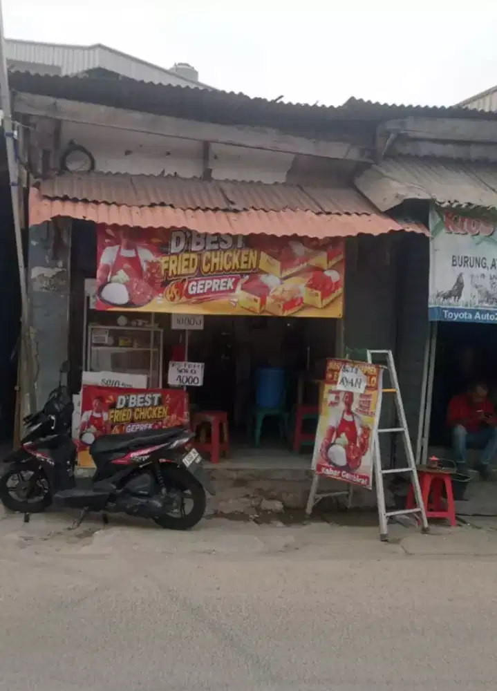 Over kontrak kios beserta isinya