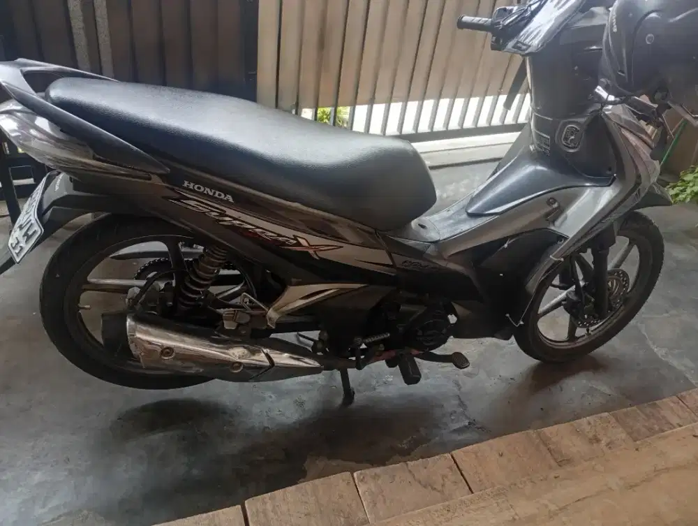 Supra 125 helm in injeksi 2012