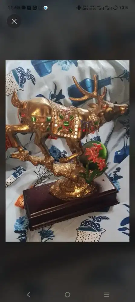patung kijang emas china