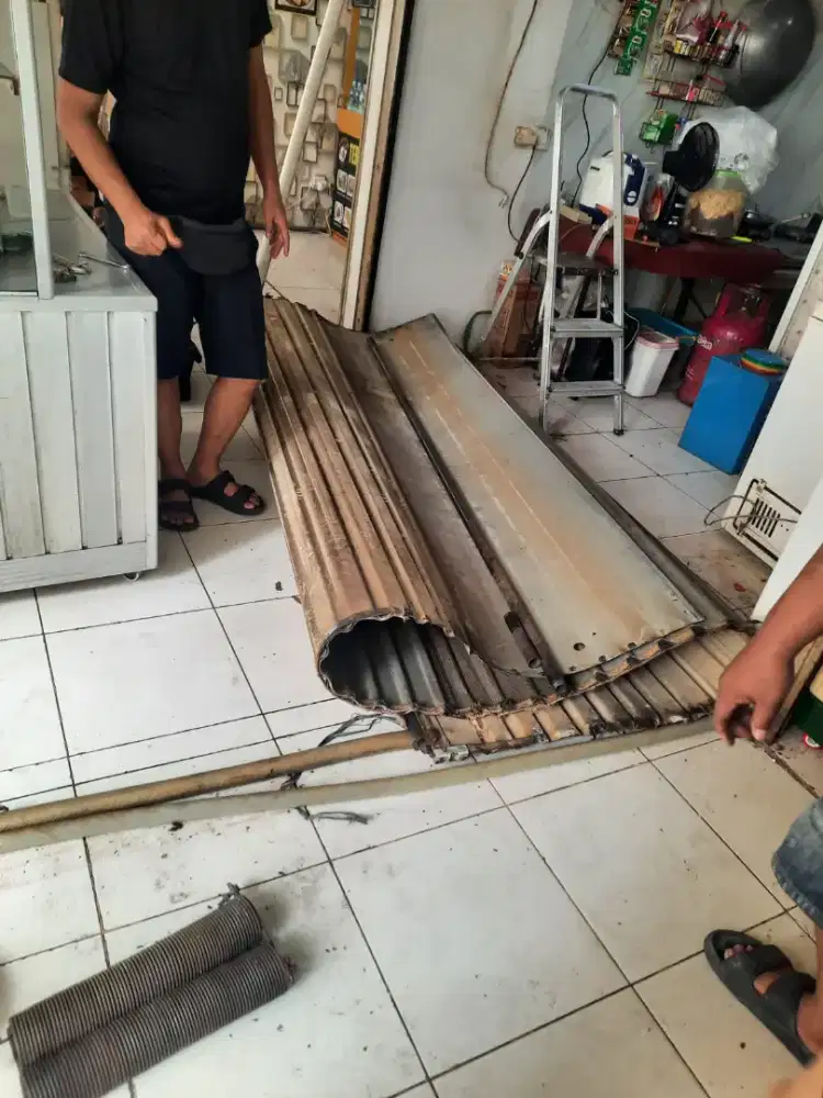 Tukang service rolling door folding gate murah